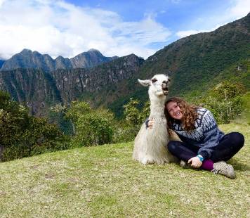 student with llama machu picchu