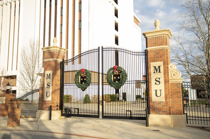 Ӱֱ State campus gates are decorated with a holiday wreath.