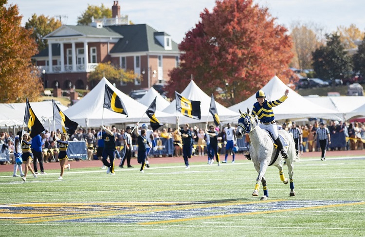 Racer One and the Ӱֱ State football team take the field. 